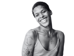 a smiling, Black transfeminine person